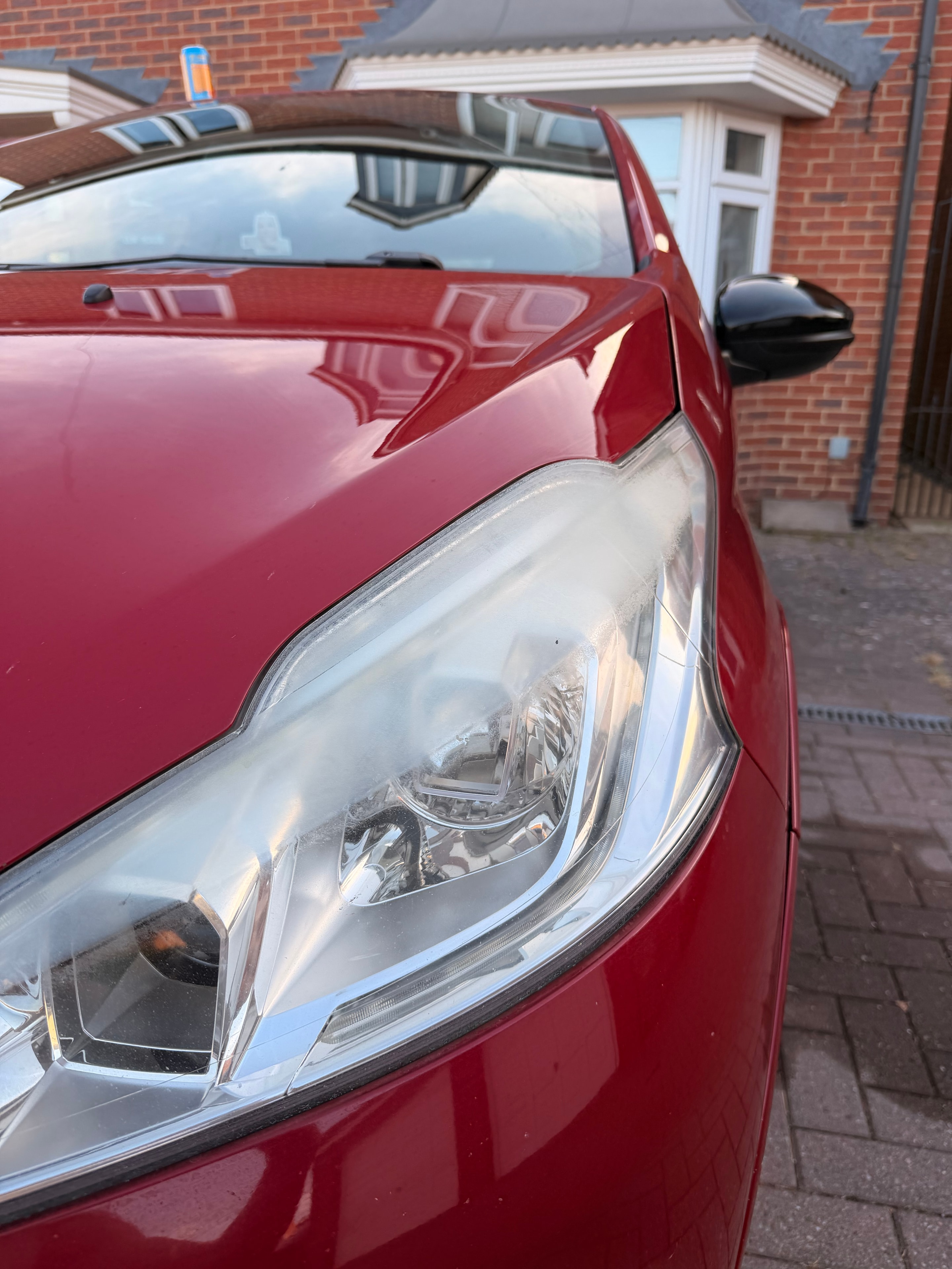 Before restoration — cloudy oxidised headlight