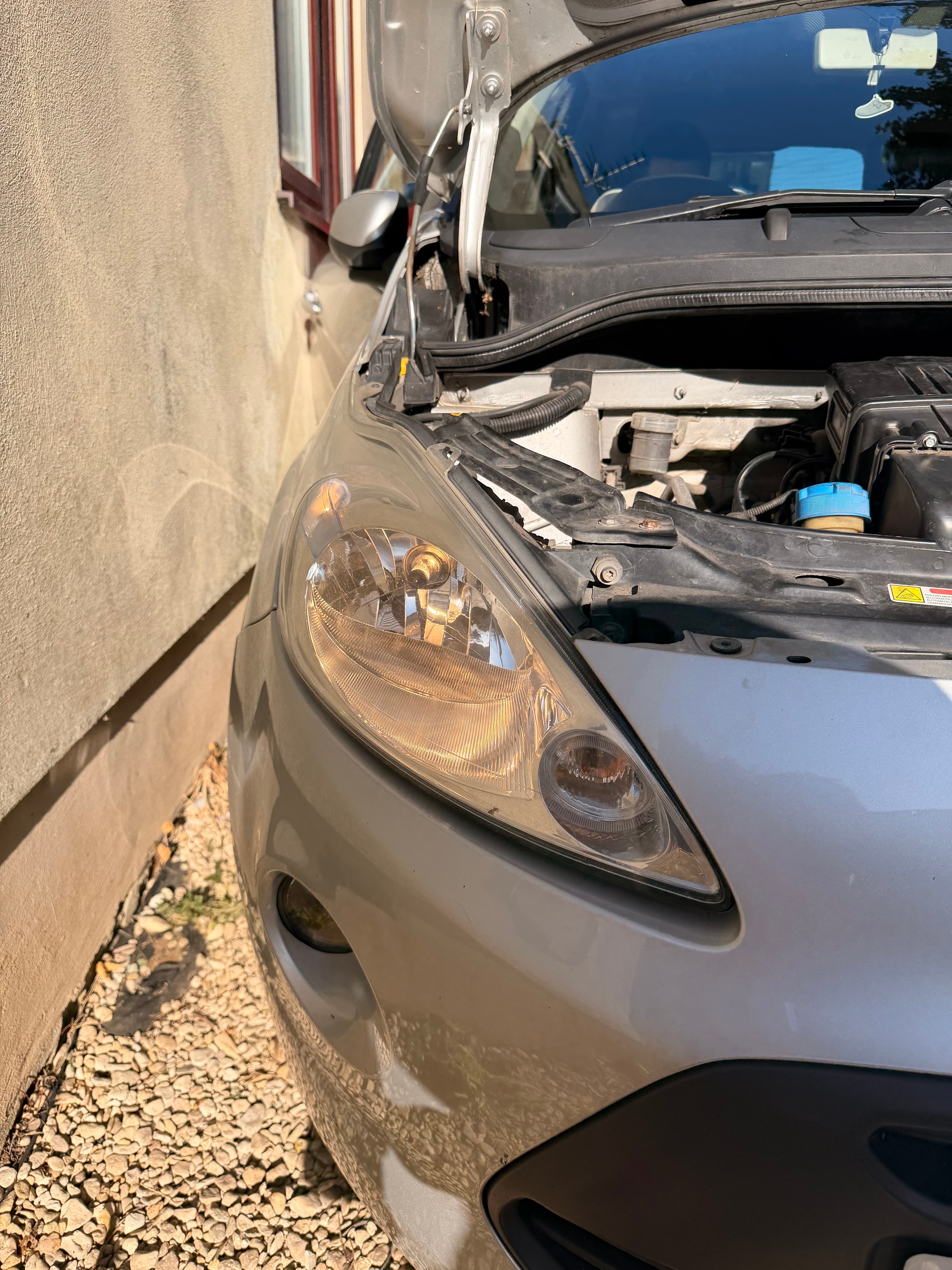 Headlight before restoration — oxidised and yellowed lens